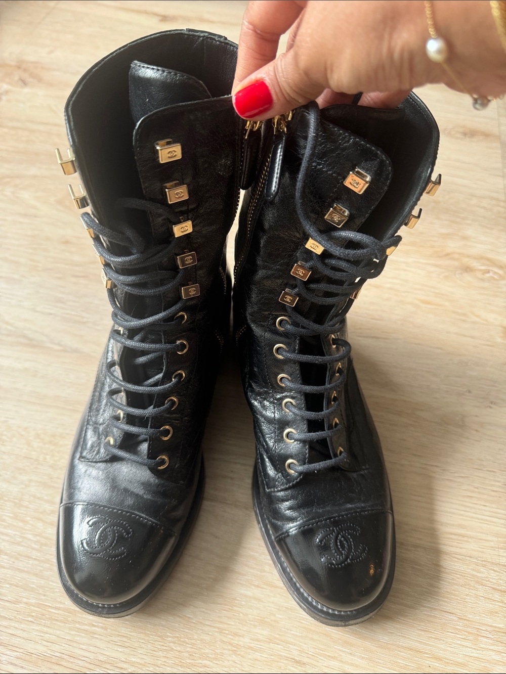 CHANEL Black Leather Lace-Up Combat Boots with Gold Accents